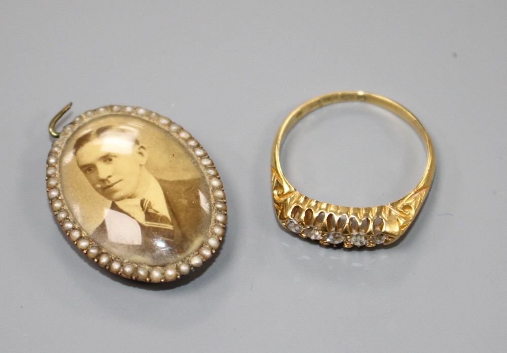 A George V 18ct gold and graduated five stone diamond ring and a 19ct century locket(a.f.).